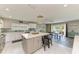 Bright kitchen with a central island, stylish backsplash, and a dining area with sliding doors to the outside at 3903 Bayside Dr, Bradenton, FL 34210
