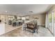 Modern kitchen with white cabinets, stainless steel appliances, kitchen island, and combined dining area at 3903 Bayside Dr, Bradenton, FL 34210