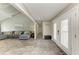 Open-concept living room with vaulted ceilings and plenty of natural light, with entry to hallway at 3903 Bayside Dr, Bradenton, FL 34210
