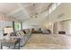 Open-concept living area boasts vaulted ceilings, a large sectional sofa, and tile floors at 3903 Bayside Dr, Bradenton, FL 34210