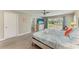 Comfortable main bedroom with access to a private balcony and an adjacent bathroom at 3903 Bayside Dr, Bradenton, FL 34210
