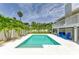 Inviting backyard oasis with pool, patio, and mature landscaping at 3903 Bayside Dr, Bradenton, FL 34210