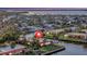 Beautiful waterfront home with lush landscaping and mature trees overlooking the serene canal and stunning bay views at 4096 El Dorado Cv, Bradenton, FL 34210