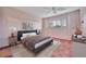 Stylish bedroom features a comfortable bed, side tables, and a window with shutters at 4096 El Dorado Cv, Bradenton, FL 34210