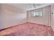 Minimal bedroom features pink carpet, curtains and a window with shutters at 4096 El Dorado Cv, Bradenton, FL 34210