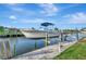 Boat lift and dock providing convenient access to the water and surrounding canal views at 4096 El Dorado Cv, Bradenton, FL 34210
