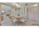 Cozy dining area features decorative wall trim and adjacent sitting area at 4096 El Dorado Cv, Bradenton, FL 34210