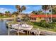 Beautiful waterfront home with a boat lift providing convenient access to the water and surrounding canal views at 4096 El Dorado Cv, Bradenton, FL 34210