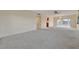 Spacious living room with view of the water, chandelier, and access to the kitchen at 4096 El Dorado Cv, Bradenton, FL 34210