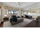Spacious main bedroom with a large window, decorative accents, and full wall mirror at 4096 El Dorado Cv, Bradenton, FL 34210