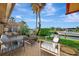 Tranquil patio featuring comfortable seating overlooking the serene canal, ideal for relaxing or entertaining guests at 4096 El Dorado Cv, Bradenton, FL 34210