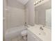 Clean bathroom features a shower over bath and sink with vanity at 4153 Fairway Dr, North Port, FL 34287