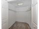 Walk-in closet with custom shelving and carpet flooring for optimal organization at 4153 Fairway Dr, North Port, FL 34287