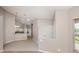Open concept kitchen features white cabinets, tile flooring, and ample counter space at 4153 Fairway Dr, North Port, FL 34287