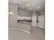 Eat-in kitchen featuring recessed lighting, white cabinetry, and tile floors at 4153 Fairway Dr, North Port, FL 34287