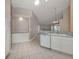Spacious kitchen with tiled floors, white cabinetry, and modern design features at 4153 Fairway Dr, North Port, FL 34287