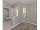 Cozy living room with plush carpeting and a bright, inviting atmosphere at 4153 Fairway Dr, North Port, FL 34287