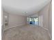 A spacious living room with a ceiling fan and a bright, airy feel at 4153 Fairway Dr, North Port, FL 34287