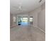 Large living room with vaulted ceilings and sliding doors to the lanai at 4153 Fairway Dr, North Port, FL 34287