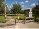 Park entrance featuring brick walkway, signage and wooden fence at 4153 Fairway Dr, North Port, FL 34287