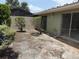 View of the backyard with sliding glass doors leading to the interior of the house at 4176 Center Pointe Cir # 70A, Sarasota, FL 34233