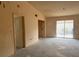 A bright and spacious living room featuring a sliding glass door for natural light at 4176 Center Pointe Cir # 70A, Sarasota, FL 34233