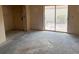 A bright living room featuring a sliding glass door for natural light at 4176 Center Pointe Cir # 70A, Sarasota, FL 34233