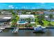 Aerial view of home showcasing a private pool, boat dock, and waterfront access at 4508 Mangrove Point Rd, Bradenton, FL 34210