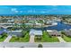 Expansive aerial view shows the waterfront neighborhood with canal access and beautiful homes at 4508 Mangrove Point Rd, Bradenton, FL 34210