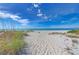 Daytime shot of an empty white sandy beach at 4508 Mangrove Point Rd, Bradenton, FL 34210