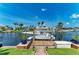 Private boat dock with boat lift offering direct access to the open waters at 4508 Mangrove Point Rd, Bradenton, FL 34210