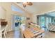 Bright dining area with views of the pool and easy access to the kitchen at 4508 Mangrove Point Rd, Bradenton, FL 34210