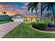 Charming single-story home with lush lawn, palm trees, and a welcoming front porch at 4508 Mangrove Point Rd, Bradenton, FL 34210