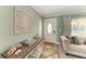 Inviting foyer with tiled floors, coat closet, decorative welcome table and plenty of natural light at 4508 Mangrove Point Rd, Bradenton, FL 34210