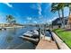 Jet skis on a private dock offering convenient access to waterfront recreation at 4508 Mangrove Point Rd, Bradenton, FL 34210