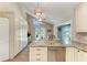Updated kitchen boasts granite counters, stainless appliances, and a view of the pool at 4508 Mangrove Point Rd, Bradenton, FL 34210
