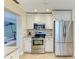 Well-equipped kitchen with stainless steel appliances and ample white cabinet storage at 4508 Mangrove Point Rd, Bradenton, FL 34210