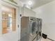 Convenient laundry room featuring a modern washer and dryer set at 4508 Mangrove Point Rd, Bradenton, FL 34210