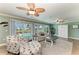Inviting living room with sliding glass doors offering views of the pool and waterfront at 4508 Mangrove Point Rd, Bradenton, FL 34210