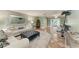 Cozy living room features comfortable sofas, a decorative mirror, and an open layout for entertaining at 4508 Mangrove Point Rd, Bradenton, FL 34210