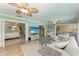 Open living space with views of both the bedroom and kitchen/dining area, perfect for entertaining guests at 4508 Mangrove Point Rd, Bradenton, FL 34210