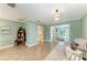 Light-filled living room boasting tile flooring, coastal decor, and an open layout at 4508 Mangrove Point Rd, Bradenton, FL 34210