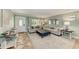 Comfortable living room featuring stylish decor, tile flooring, and access to the front entrance at 4508 Mangrove Point Rd, Bradenton, FL 34210