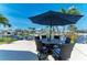 Inviting patio with a dining area and views of the canal at 4508 Mangrove Point Rd, Bradenton, FL 34210