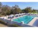 The community pool is complete with lounge chairs, umbrellas, and a clear blue swimming pool at 4524 Baltry Ct, Bradenton, FL 34211
