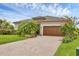 Charming single-story home featuring a brick paved driveway and tropical landscaping in a community at 4524 Baltry Ct, Bradenton, FL 34211