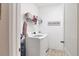Practical laundry room featuring modern appliances and a SEASIDE decorative sign at 4524 Baltry Ct, Bradenton, FL 34211