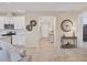 An open-concept living room area with wood-look tile flooring and neutral paint throughout at 4524 Baltry Ct, Bradenton, FL 34211