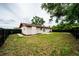 A backyard view with a partial lawn and a black-fenced perimeter at 4616 34Th E Ave, Bradenton, FL 34208