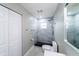 Well-lit bathroom with walk-in shower, black flooring, and modern fixtures at 4616 34Th E Ave, Bradenton, FL 34208